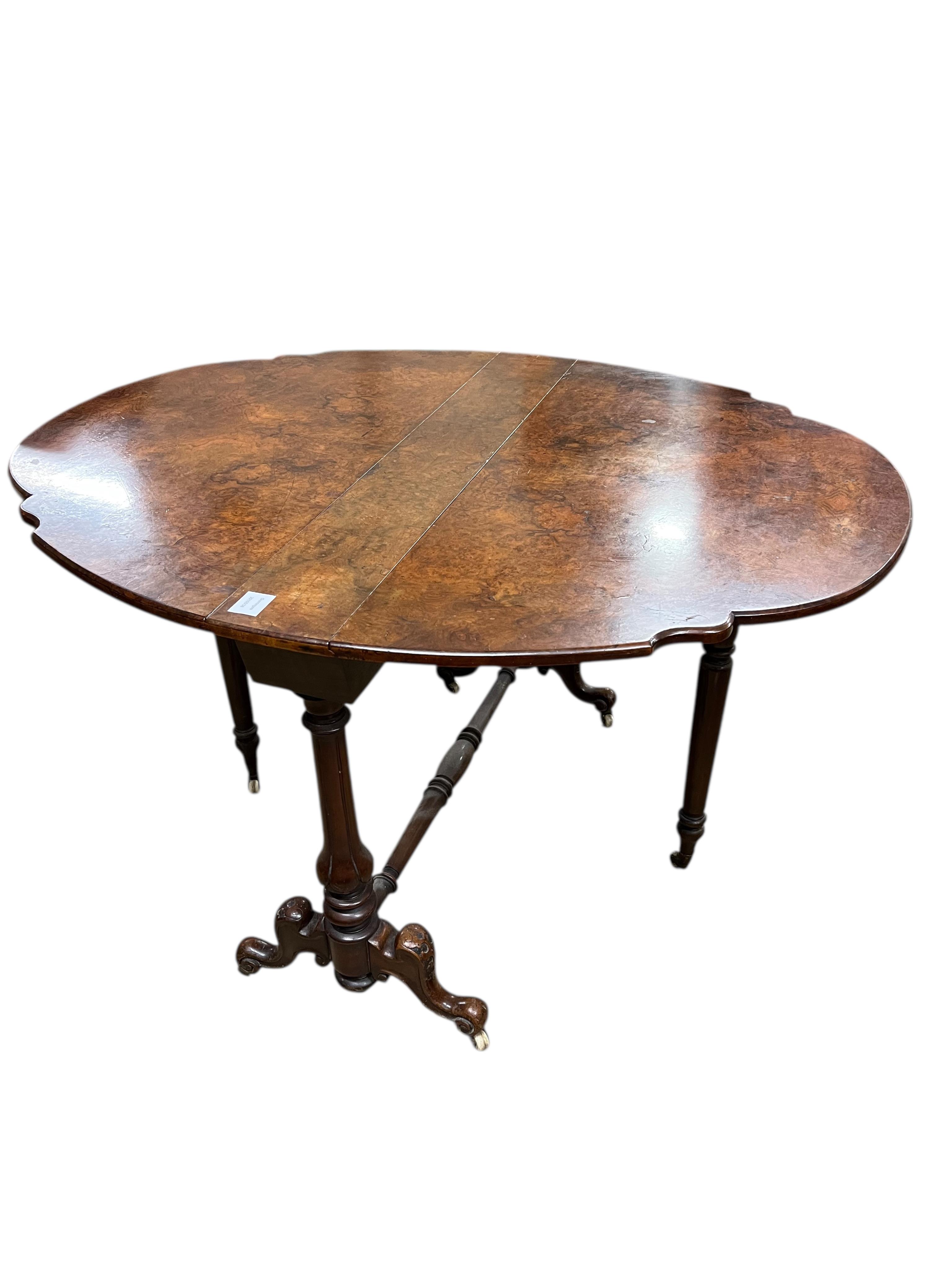A Victorian walnut Sutherland table, width 92cm, height 68cm